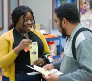 Student shows another student a flier