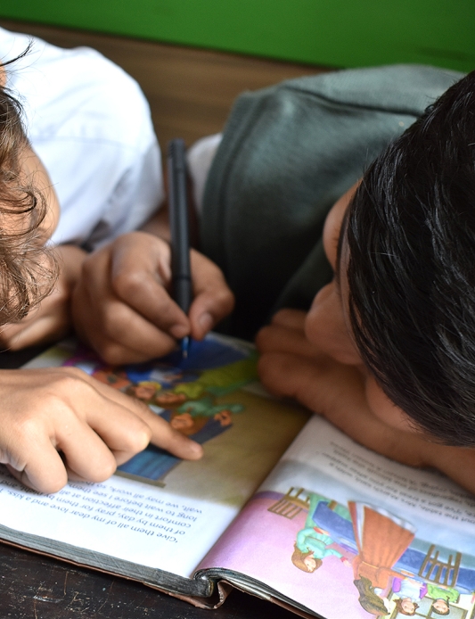 Two children with a book